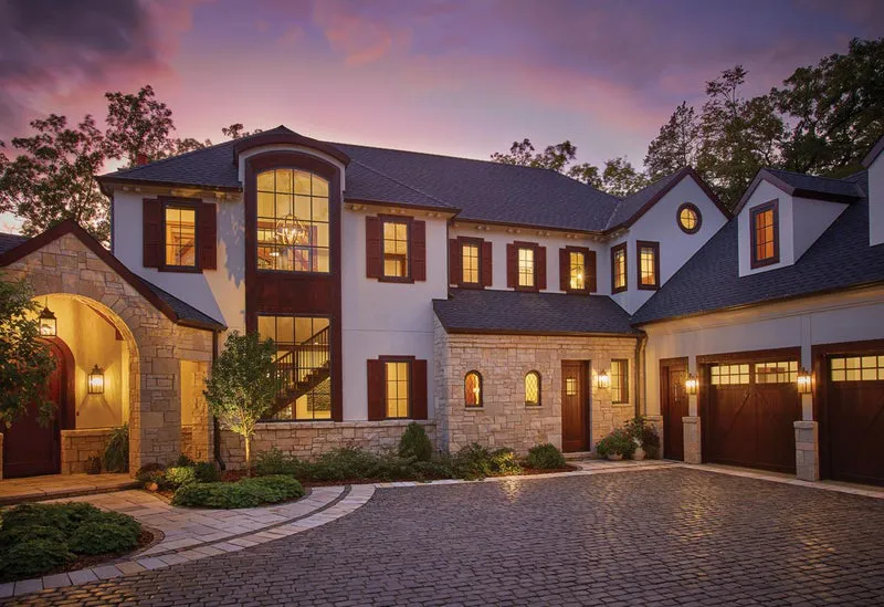 Beautiful home and lights lit up at dusk. - Pronail Outdoors